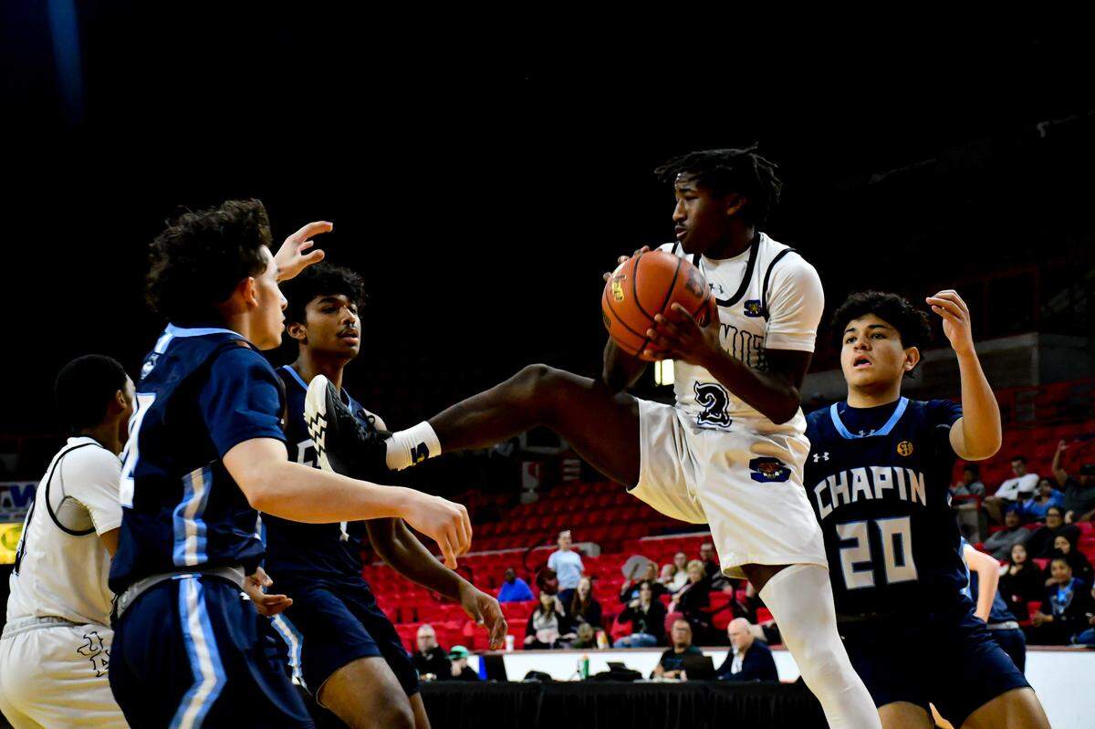 Mansfield Summit’s Jeffery Scott pulls down a rebound against El Paso Chapin in the Class 5A Region I Championship game on March 4, 2023, at the Yeager Coliseum in Wichita Falls, Texas.