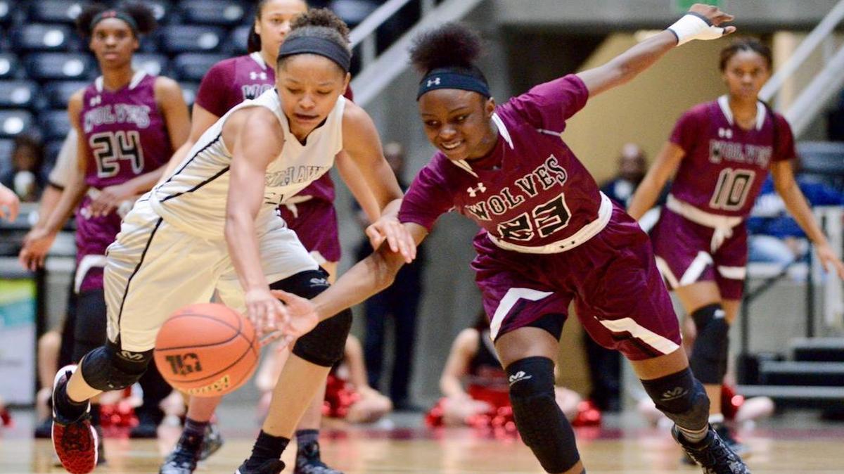 Timberview’s Trelynn Tyler, right, scoops up a loose ball in Saturday’s regional final against Frisco Liberty.