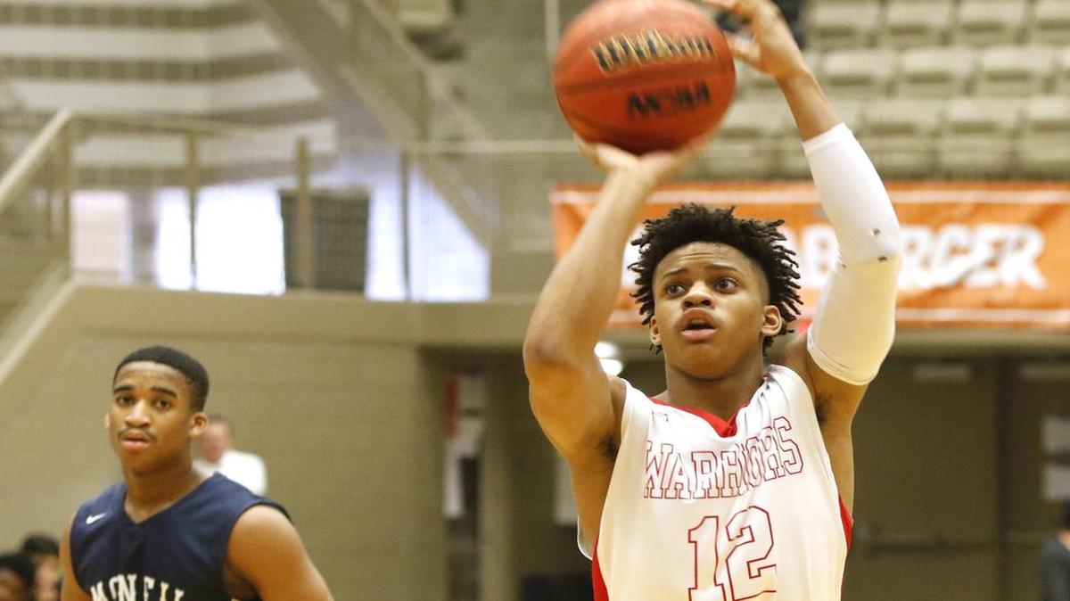 Martin point guard Nick Gardner (12) puts up the first point vs Round Rock McNeil in a Whataburger Orange Division basketball tournament game Dec. 28, 2016.