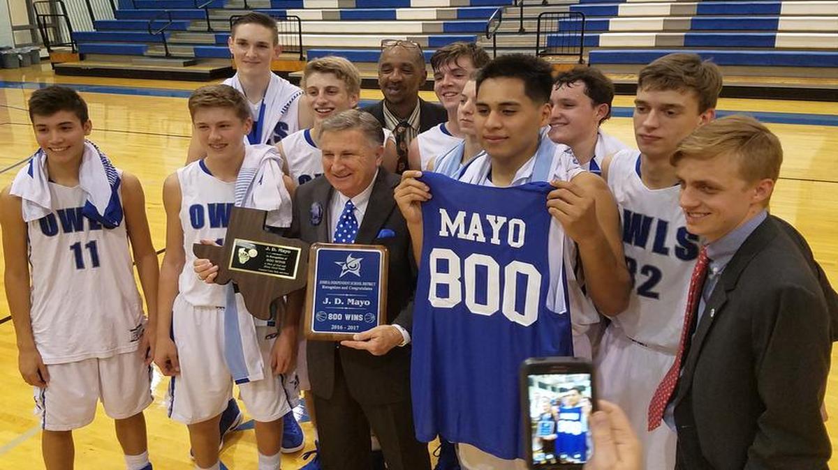Joshua head coach JD Mayo (center) is honored after winning his 800th career game Tuesday night as the Owls beat FW Benbrook 66-53.
