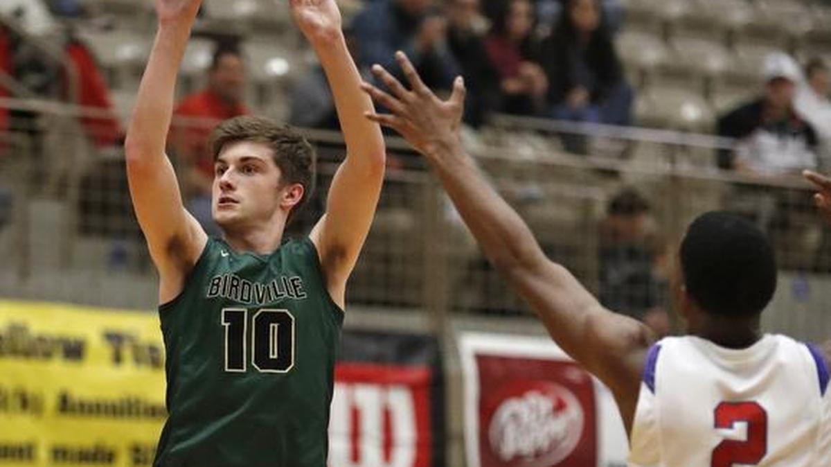 Birdville’s Noah Wheeless (10) gets off a shot while drawing defensive coverage from Little Rock Parkview guard Larodrius Terry in the 2017 Whataburger Basketball Tournament, Dec. 28, 2017.