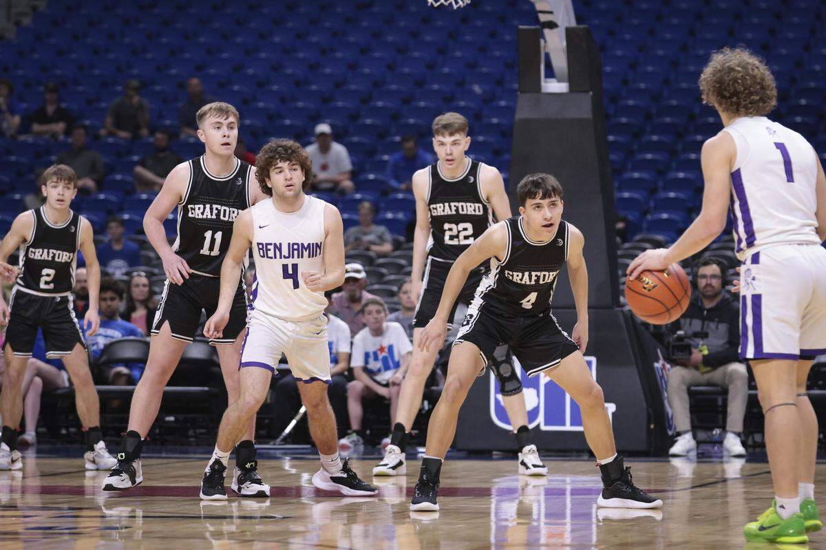 Christian Shea (2), Connor Waters (11), Colin Roberts (22) and McKennon Lemley (4 in black) of Graford attempt to defend Grayson Rigdon (1) and Tallon Hayes (4 in white) of Benjamin in a Class 1A state semifinal on Thursday, March 9, 2023 at the Alamodome in San Antonio, Texas.
