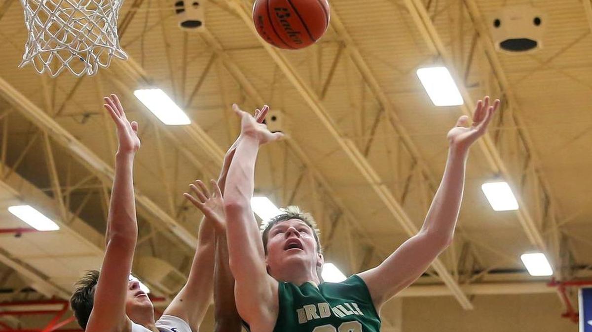 Birdville forward Will Sorrells (30) draws Grapevine defenders Matthew Green (5) and Andrew Lastinger (42), Jan. 8, 2016.