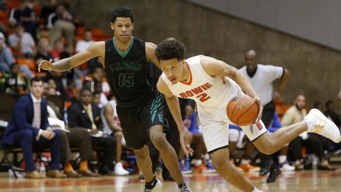 Arlington Bowie Volunteers forward Cade Cunningham (2) makes a steal in front of Ellison Eagles forward Marvin Caines (15) last March in the playoffs.