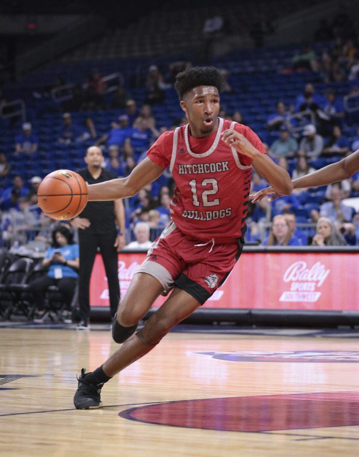 Hitchcock guard Elijah Sherwood drives around the top of the key in the Bulldogs win over Hooks in the Class 3A state semifinals on Thursday, March 9, 2023 at the Alamodome in San Antonio, Texas. Sherwood scored a game-high 22 points.