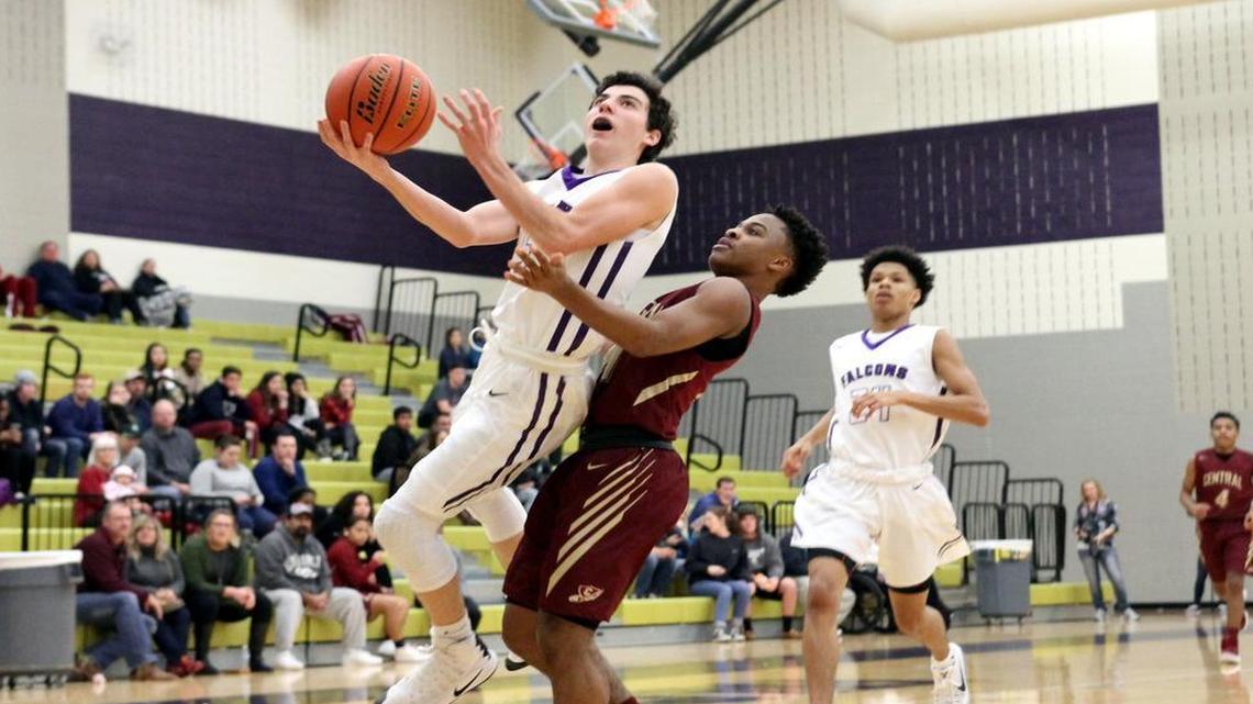 Keller Timber Creek guard Jimmy Mouser attempts a layup against Keller Central’s Jakobe Kirk, Dec. 20, 2016.
