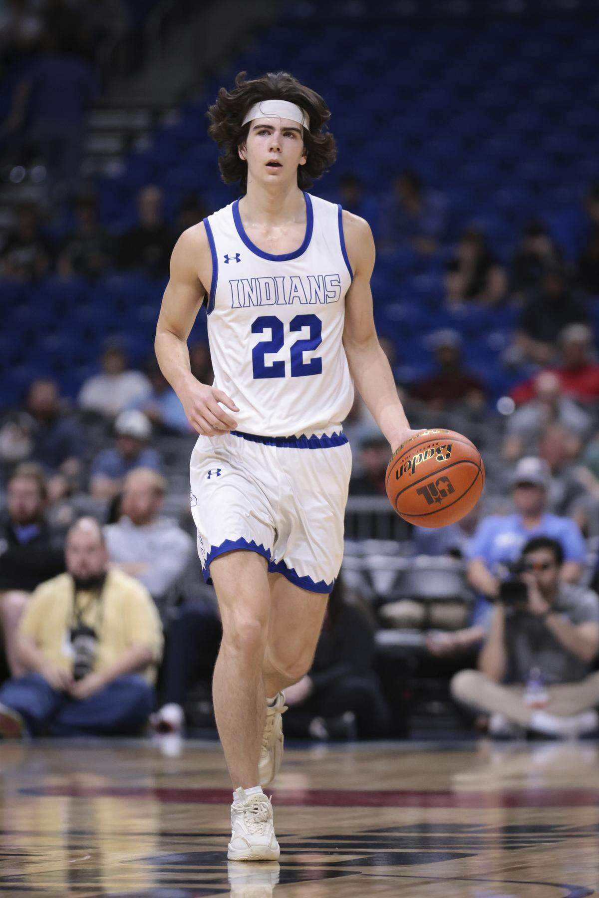 Lipan’s Tripp Phillips dribbles the ball up court during the Indians 52-44 win over New Home in the Class 2A state semifinals on Friday, March 10, 2023 at the Alamodome in San Antonio.