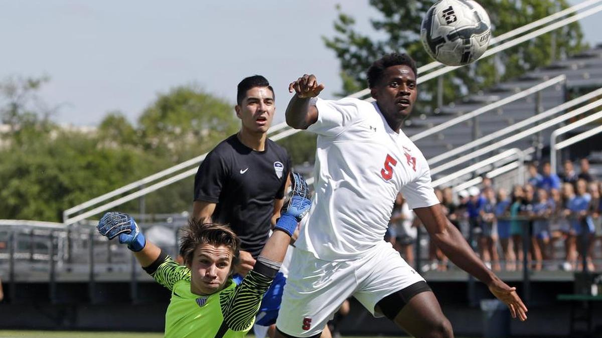 Sam Houston's Kevin Tankou (5) puts the equalizer past Hebron's goal keeper Chase Weinman (1) as Sam Houston played Hebron in a 6A Region 1 Finals Soccer game at Dragon Stadium Saturday April 08, 2017.