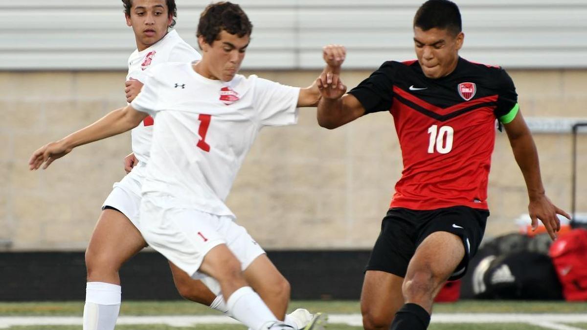 Diamond Hill-Jarvis senior Jose Levario (10) battles for the ball against Argyle’s Michael Rigsby in a 2017 playoff game at Bearcat Stadium in Aledo.