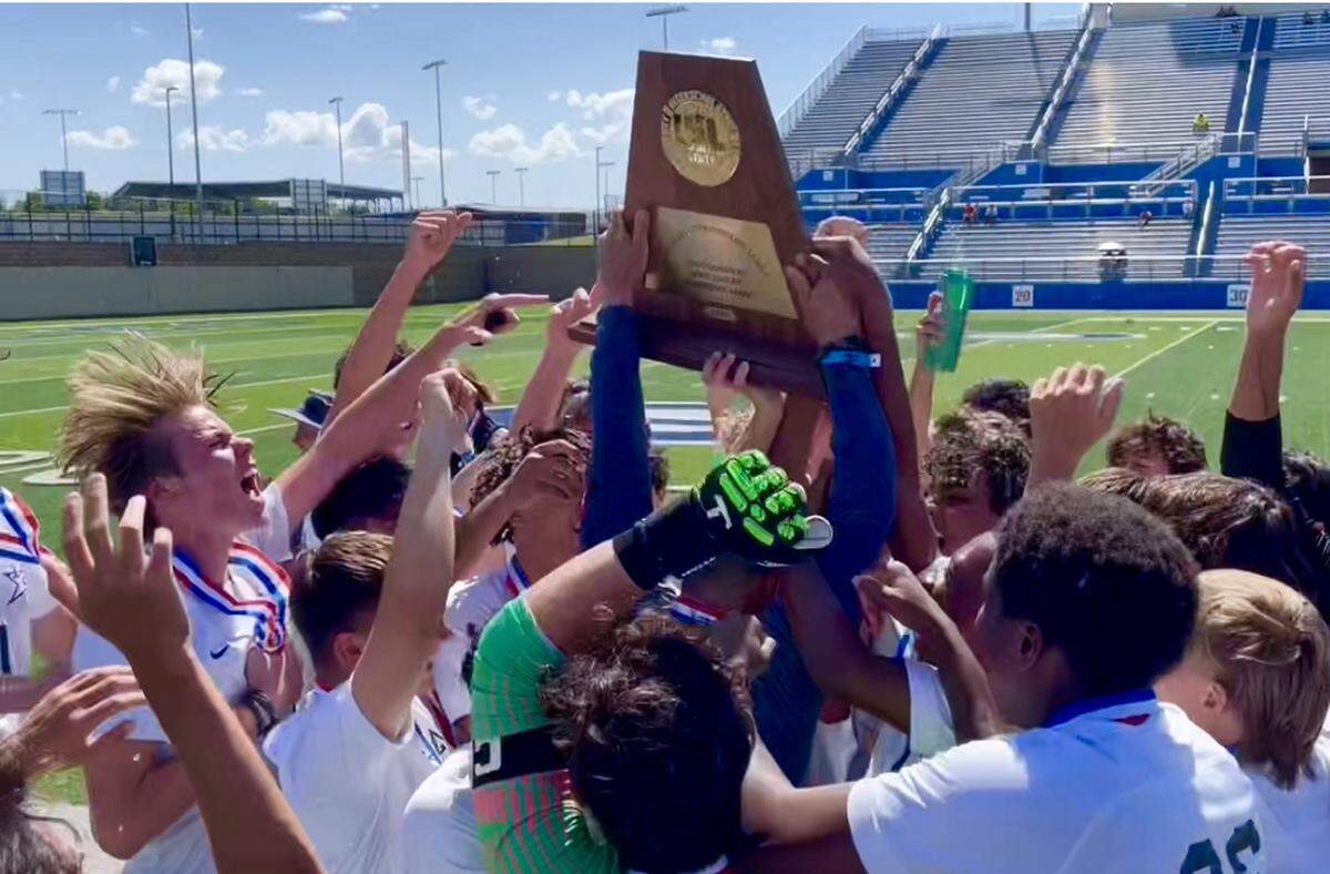 The Frisco Lone Star boys soccer team hoists the championship trophy after defeating El Paso Bel Air 4-1 in the Class 5A state title game on Saturday, April 15, 2023 at Birkelbach Field in Georgetown, Texas.