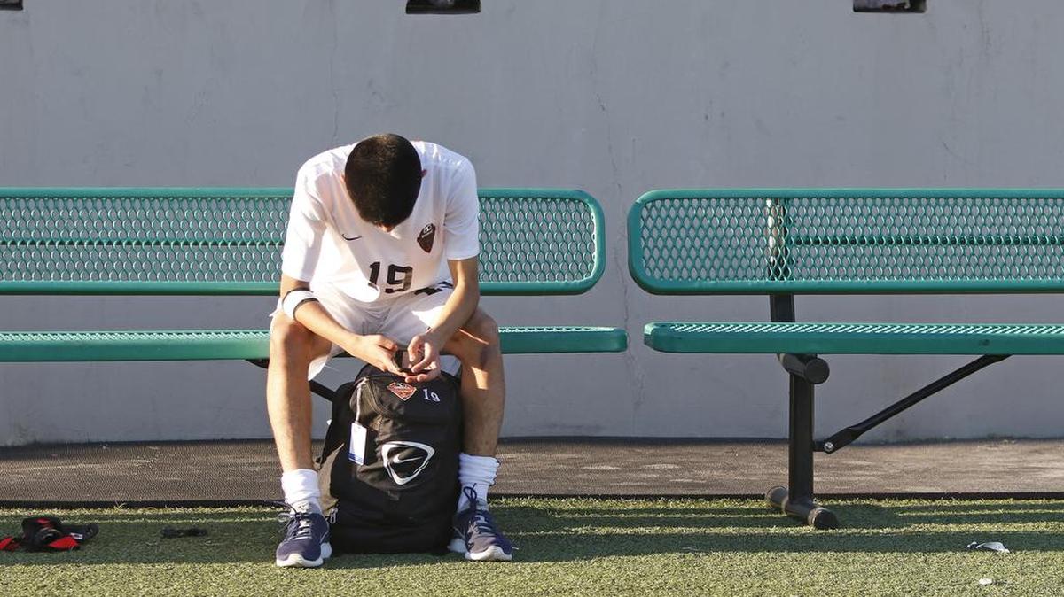 Bowie’s Osvaldo Sanchez (19) sits alone on the bench after their loss to Hebron in a 6A Region 1 Semifinal Soccer game at Dragon Stadium Friday April 07, 2017. Hebron defeated Arlington Bowie 2-0. (Special to the Star-Telegram Bob Booth)