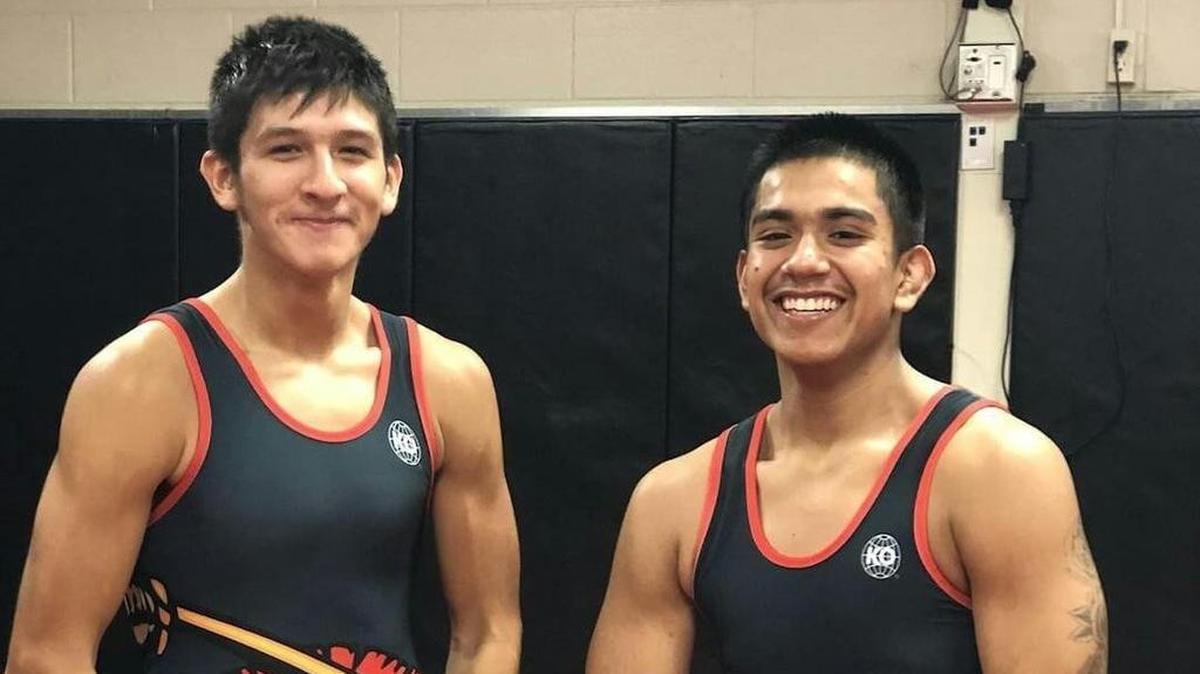 Johnny Hernandez, left, at 145 pounds, and teammate John Valdez.