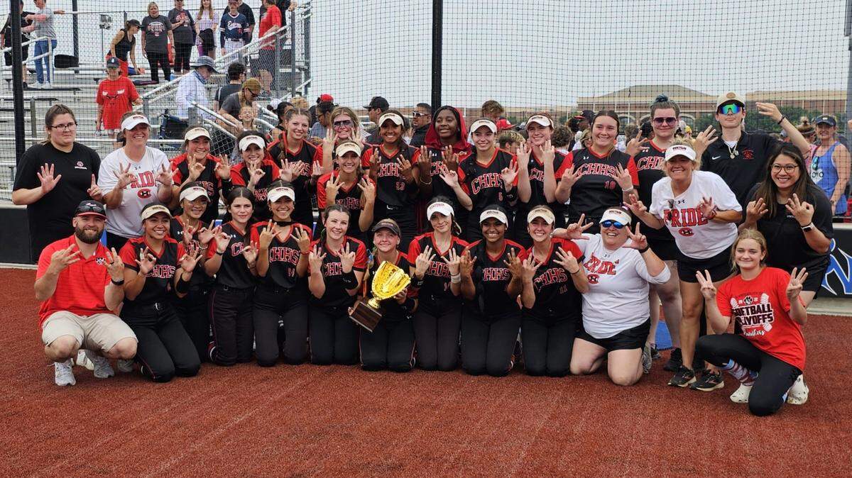 The Colleyville Heritage softball team poses after winning Game 3 of its Class 5A Region I Final series to advance to the state tournament on Saturday, May 27, 2023 at Byron Nelson High School in Trophy Club, Texas.
