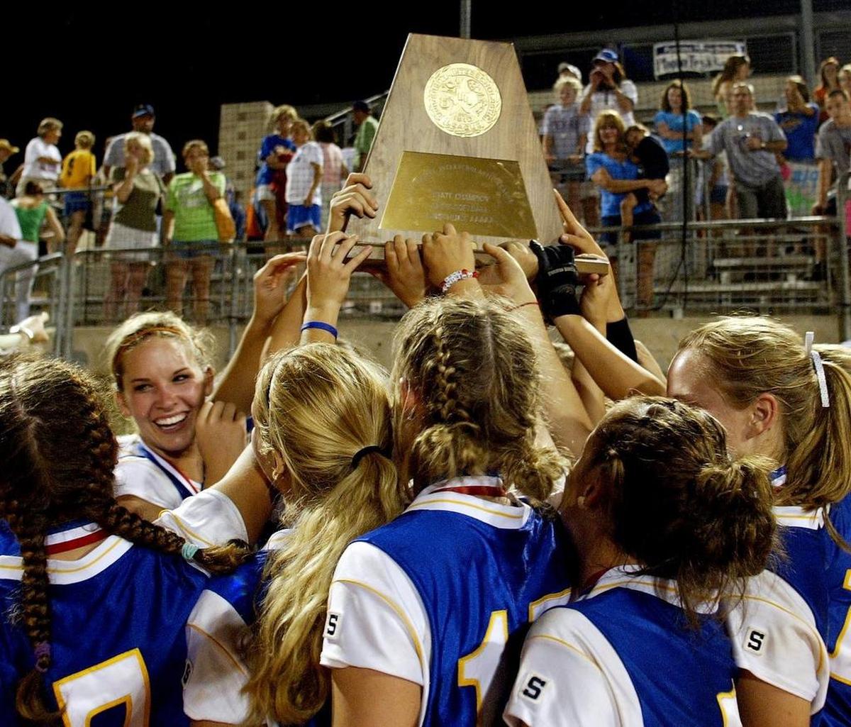Keller players celebrate their victory in a high school softball state final game in Austin between Keller High School and Garland High School on June 4, 2005.