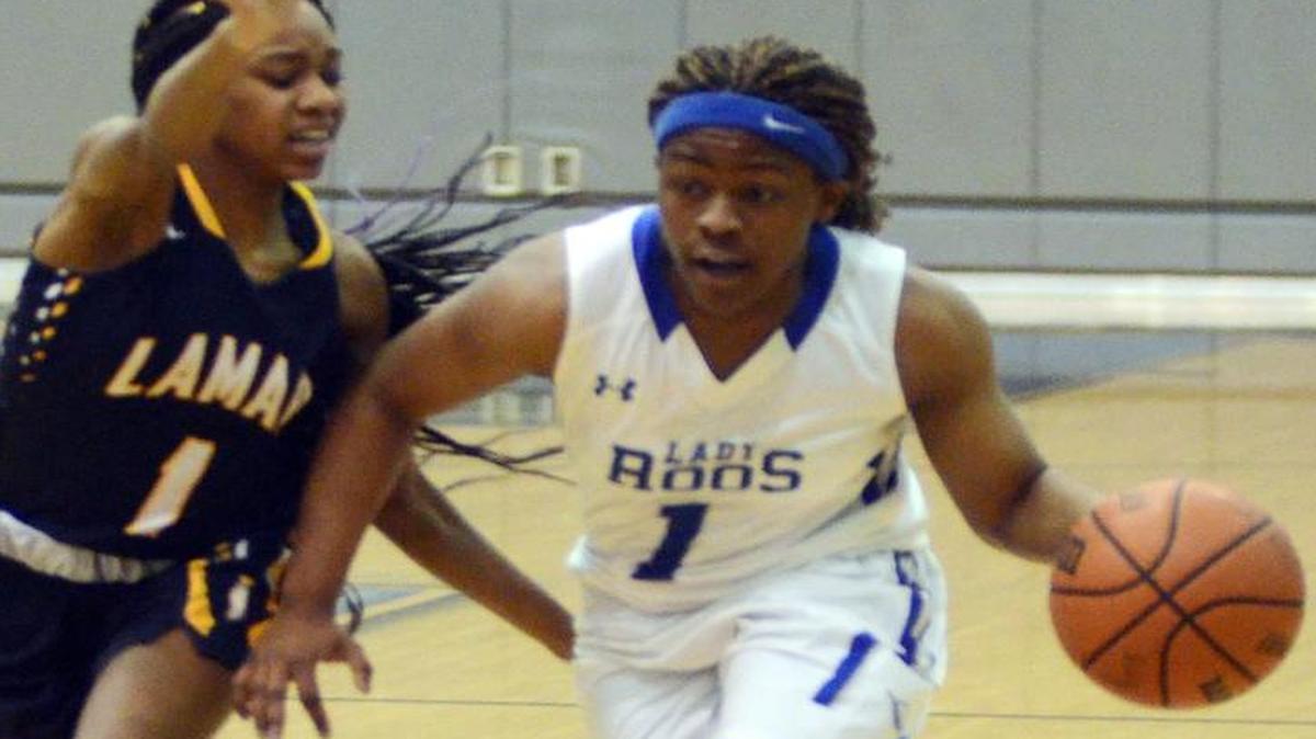 Weatherford’s Anna Jefferson-Polk drives around Lamar’s Pam Byrd. Jefferson-Polk finished with 15 points.