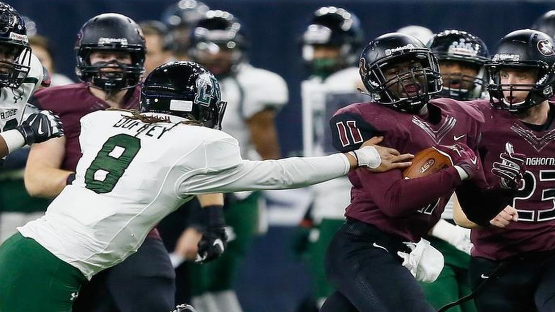 George Ranch’s Jairon McVey (11) is tackled by Lake Ridge’s Jett Duffey (8) after an interception in the Class 5A Division I title game.