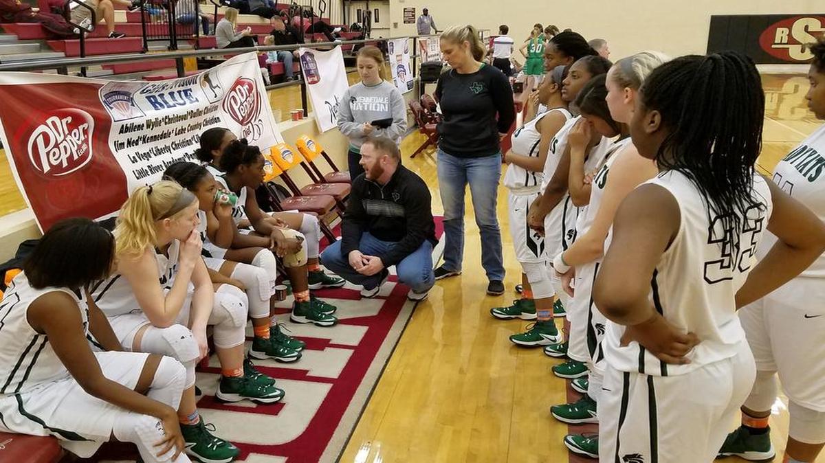 Kennedale girls basketball coach Doug Watson talks to his team in a timeout during their 57-41 victory over Wall on Thursday at Saginaw High School.