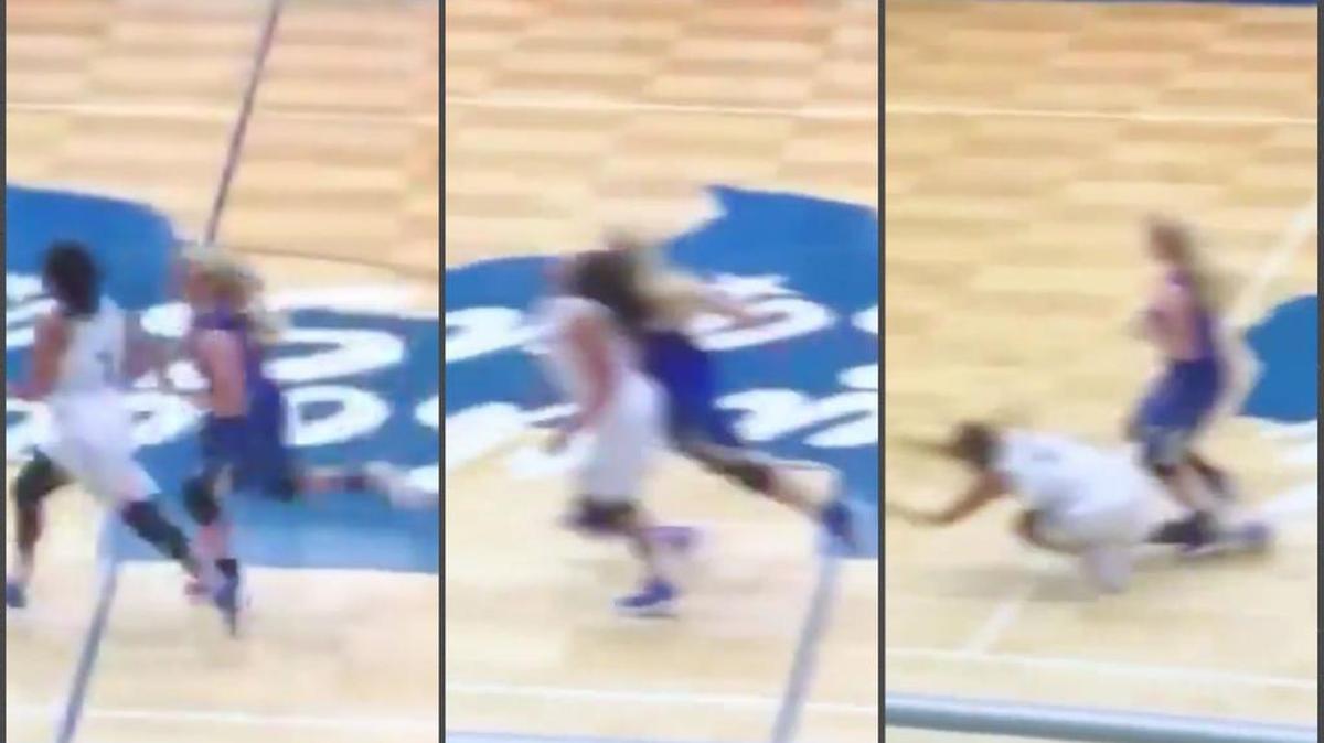 A girls basketball player from Kerrville-Tivy (in blue) was suspended just two games after sucker punching a player from South San Antonio during a game in November.