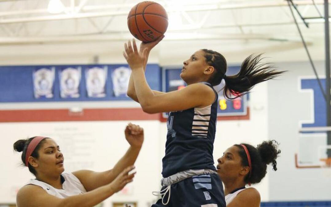 Bell's Lexi Gordon (34) shoots over Richland's Porscha Miseles Huff. L.D. Bell defeated Richland 41-35 on Tuesday, January 5, 2016.