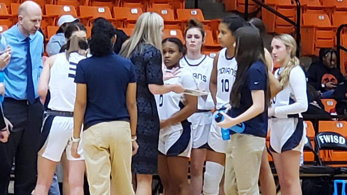 Keller coach Kate Goldberg goes over strategy with her team late in the fourth quarter of their Class 6A Region 1 semifinal against Little Elm on Friday, February 24, 2023 at the Wilkerson-Greines Activity Center in Fort Worth, Texas.