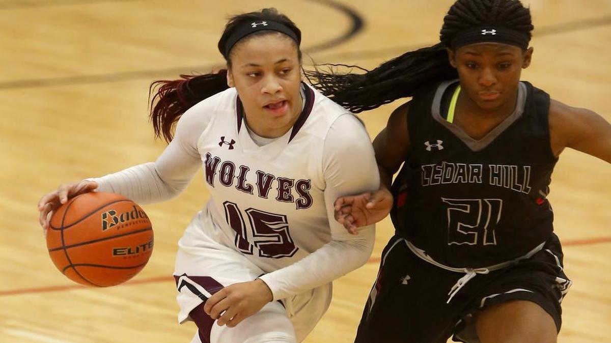 Mansfield Timberview guard Chennedy Carter (15) drives against Cedar Hill guard Kyla Howard (21) in the second half on Thursday, Dec. 29, 2016.