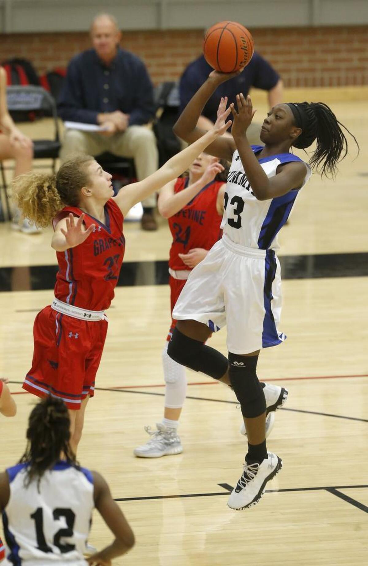 Mansfield Summit post Tommisha Lampkin shoots over Grapevine’s Kate Dickson in the first half in the Mansfield Spring Creek high school basketball tournament in 2017.