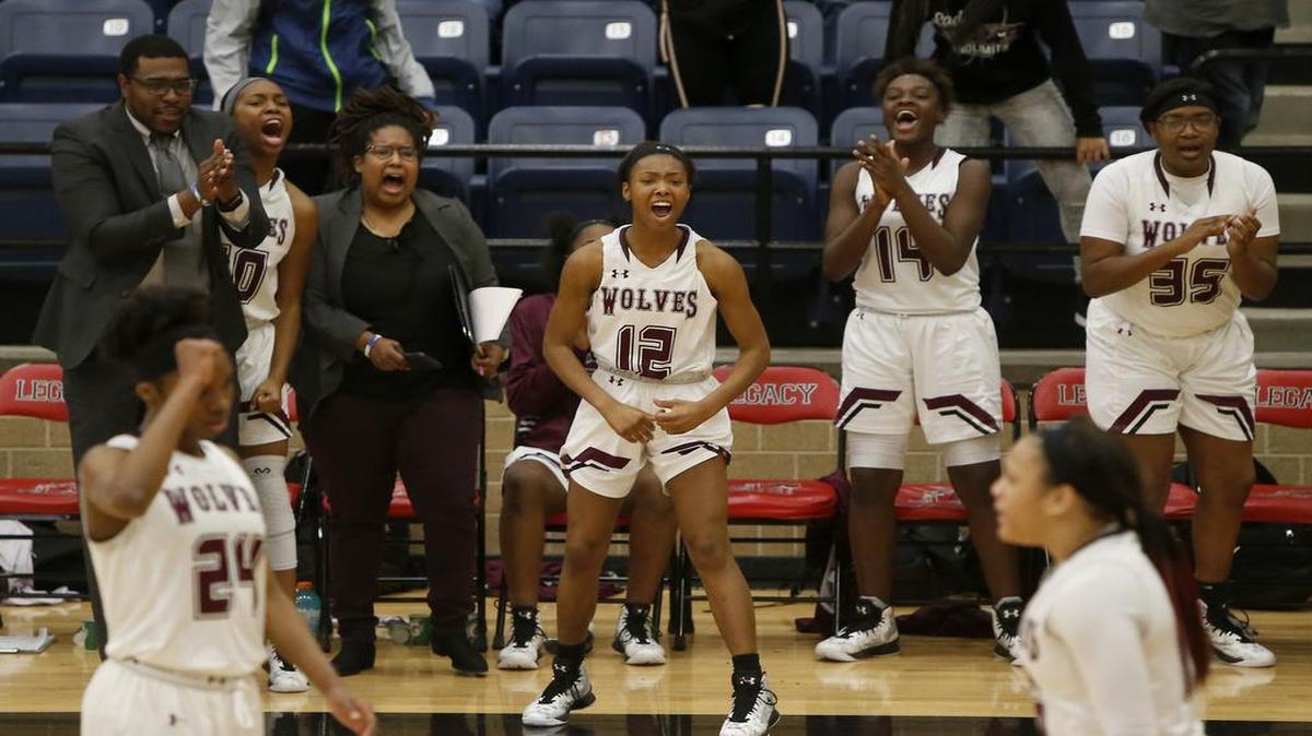 The Mansfield Timberview bench erupts after the team retook the lead late in the second half against the Cedar Hill, Dec. 29, 2016. Timberview won 67-62.