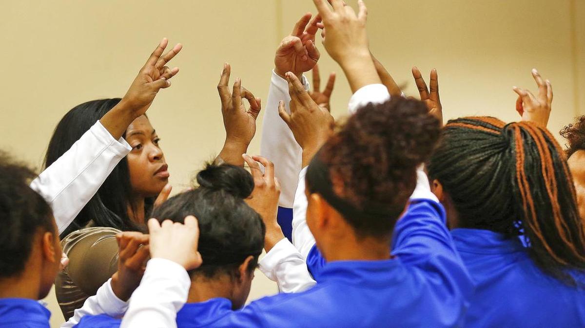 Arlington Bowie huddles up against Fort Worth Paschal in girl’s high school basketball Tuesday December 16, 2014 in Fort Worth, Texas.
