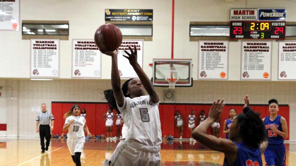 Mariah Roberts (5) goes for a layup against Arlington Bowie on Jan. 23.