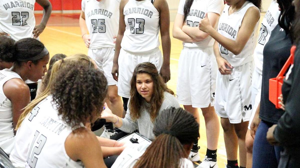 Interim Martin head coach Bethany Gonzalez counsels her team during a timeout on Nov. 7.