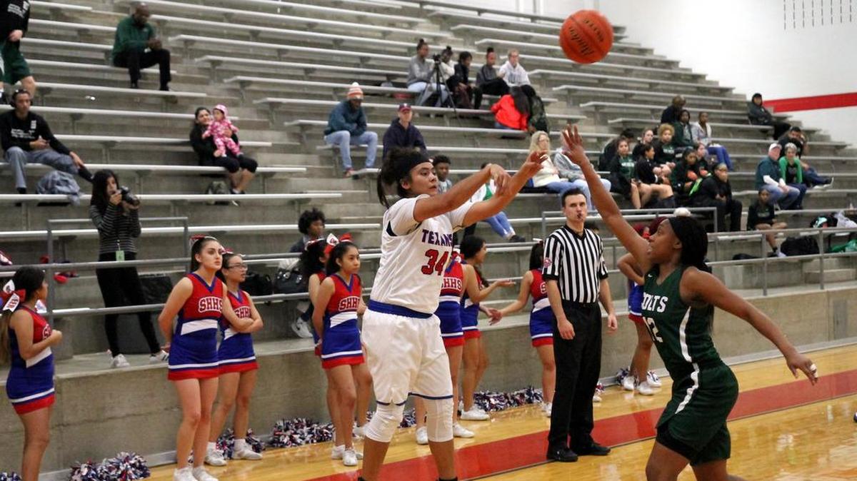 Jimena Cortez (34) passes in action against Arlington High on Jan. 19. She’s the team’s leading scorer and the district’s top shot blocker but was injured in the game.