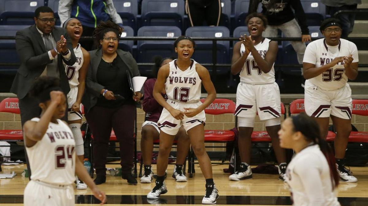 The Mansfield Timberview bench erupts after the team retook the lead late in the second half against Cedar Hill on Thursday, Dec. 29, 2016.