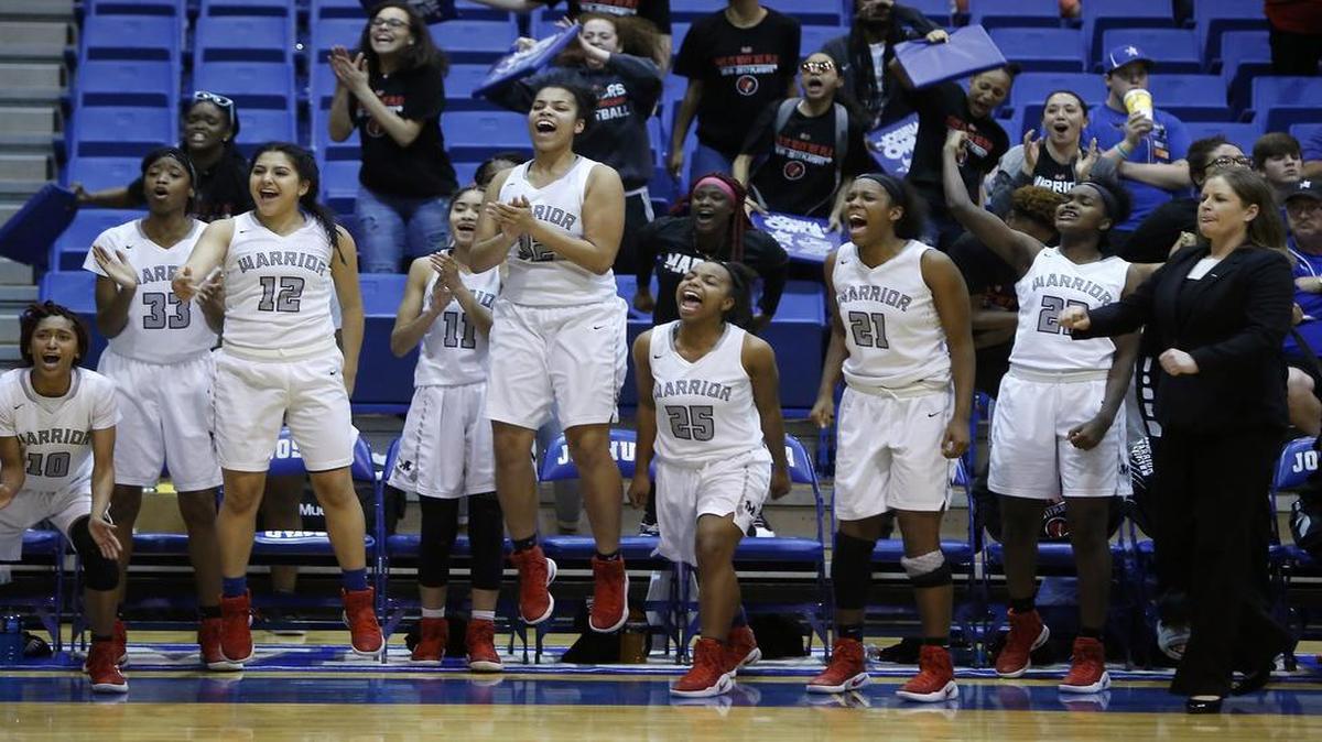 The Arlington Martin bench erupts after a score by Tiara Malone in overtime against Weatherford, Feb. 13, 2017 at Joshua High School. Martin won 41-38.