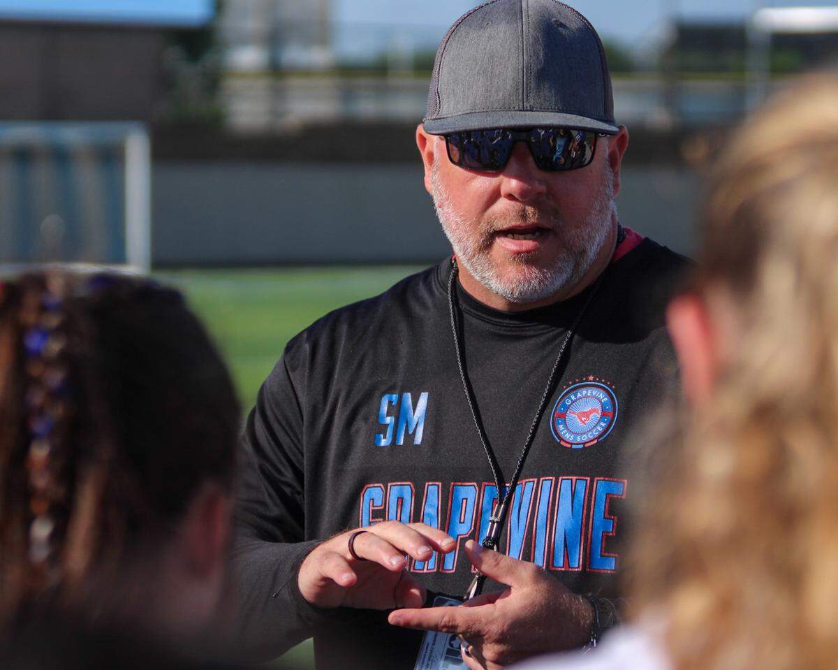 Grapevine coach Steve McBride addresses his team during a Class 5A state semifinal against Smithson Valley on Thursday, April 13, 2023 at Birkelbach Field in Georgetown, Texas.
