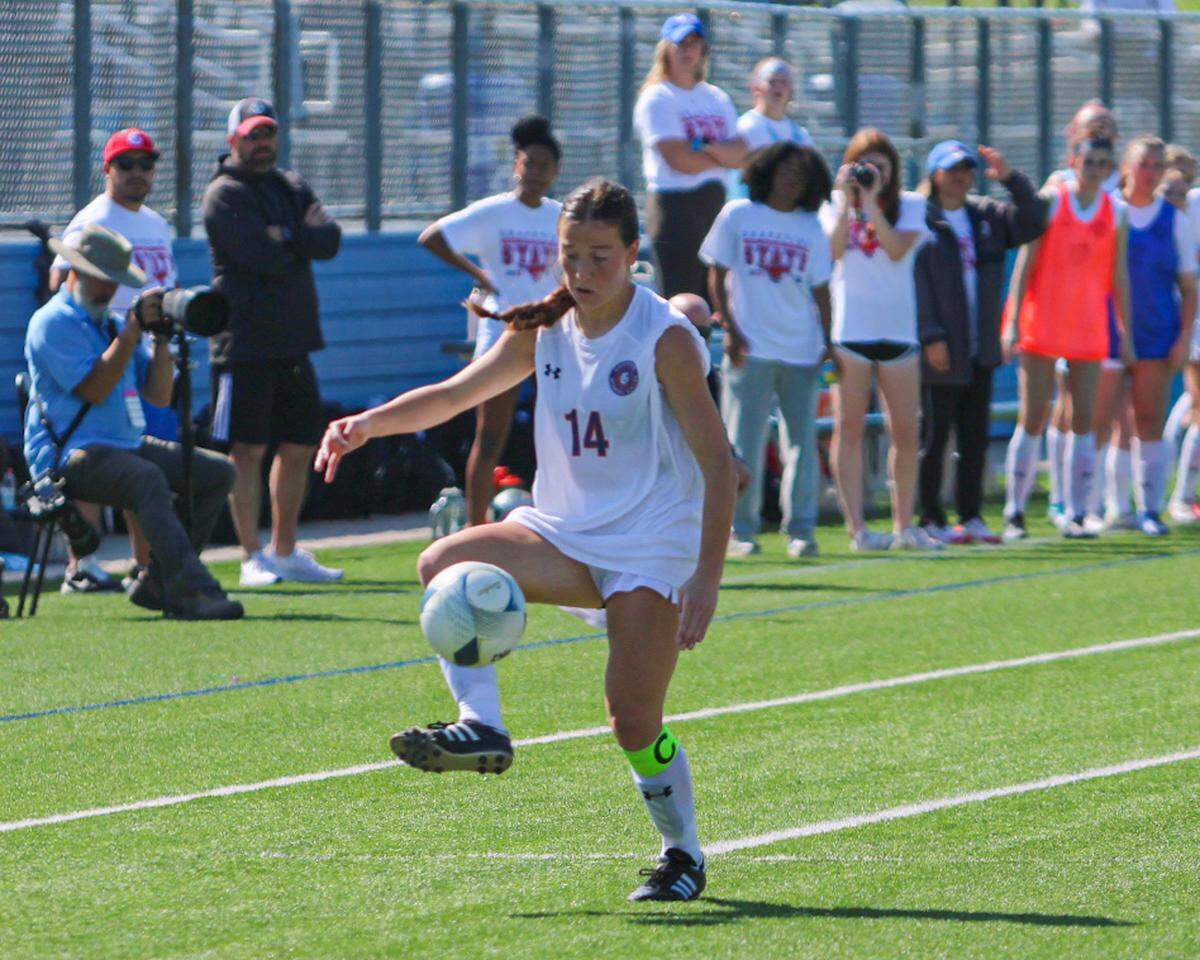 Grapevine’s Theresa McCullough (14) gets control of the ball against Smithson Valley in a Class 5A state semifinal on Thursday, April 13, 2023 at Birkelbach Field in Georgetown, Texas. McCullough scored two goals in the Mustang’s win.
