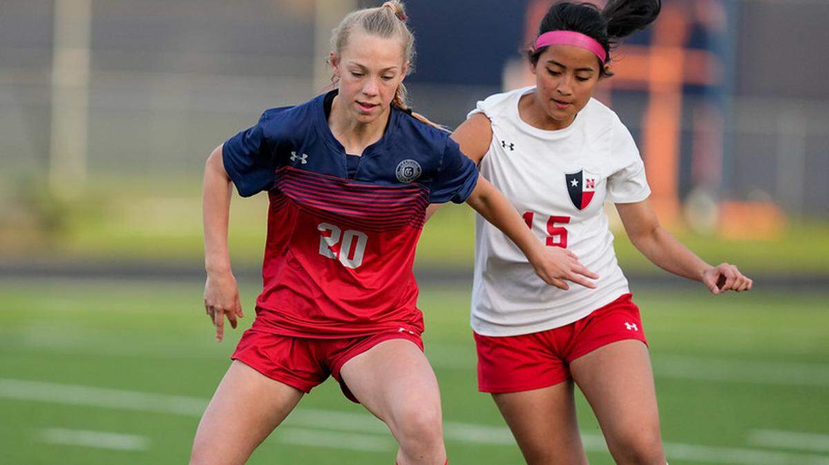 Grapevine High Schools Hayden Carnahan (20) attempts to dribble past a defender. Grapevine will play in the state semifinals on Thursday.