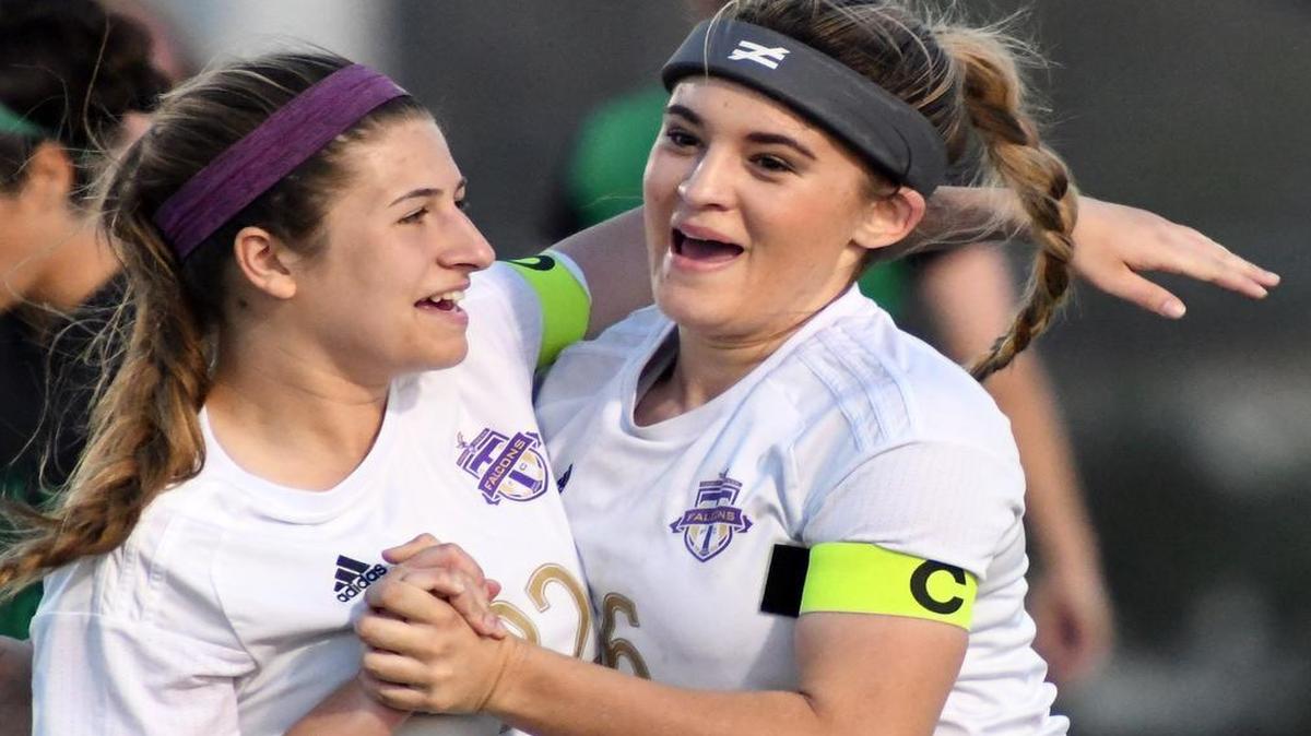 Timber Creek's Courtney Sebazco, left celebrates with teammate Haley Ward after Ward scores a goal to take a 1-0 lead over Arlington in the first half of Thursday's March 23, 2017 playoff soccer game at Fossil Ridge High School.