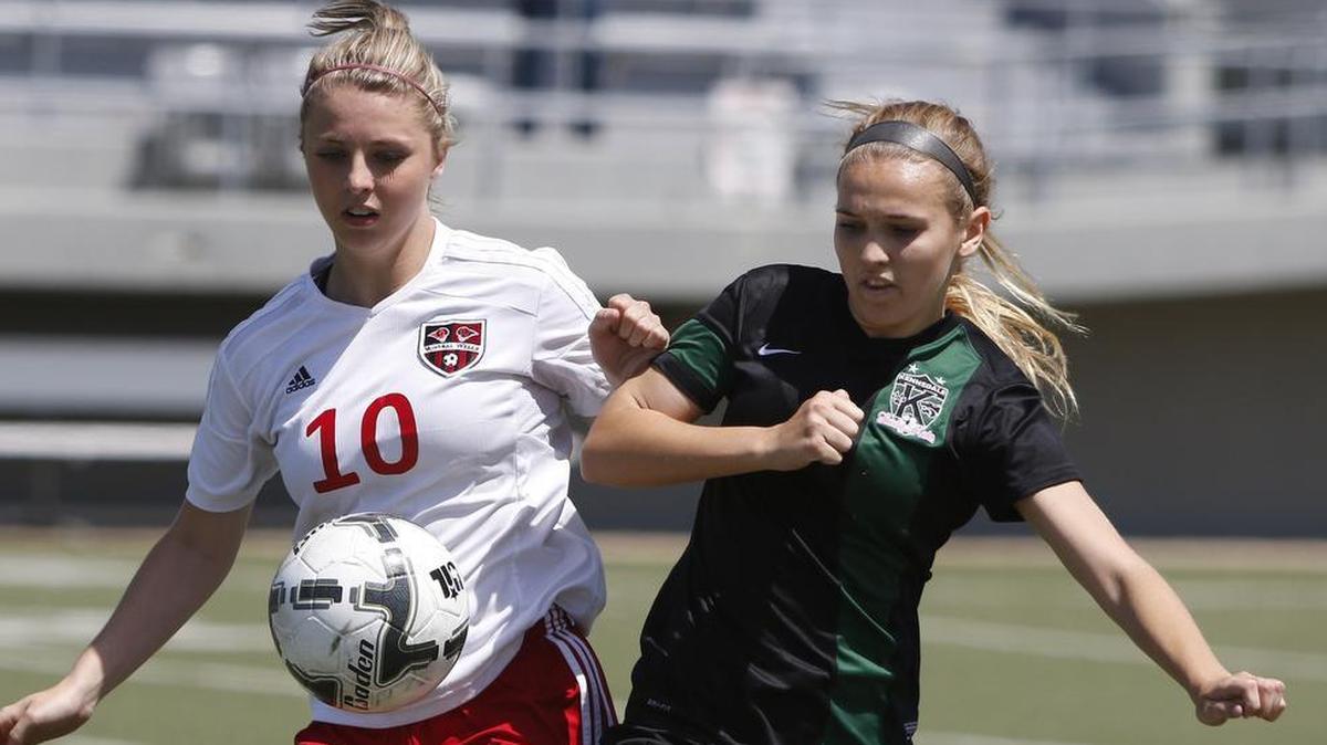 Mineral Wells' Samantha Cienega (10) and Kennedale midfielder Daphne Hunt (11) battle for control as Kennedale played Mineral Wells in a 4A Girls Soccer Regional Semifinalist Spccer Playoff game at Birdville Fine Arts Activity Center Friday April 07, 2017.