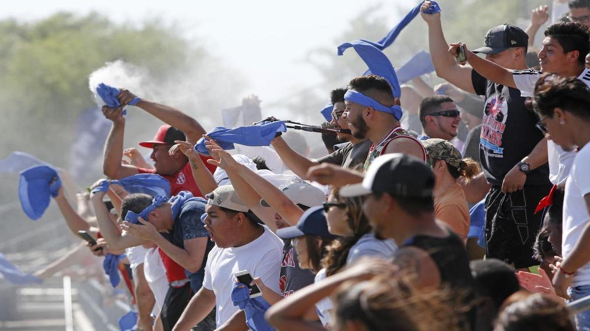 Fans celebrate a goal with powder as Sam Houston played Hebron in a Class 6A Region 1 finals soccer game Saturday at Dragon Stadium. The Texans clinched a state berth with a 3-2 win over the Hawks in overtime.