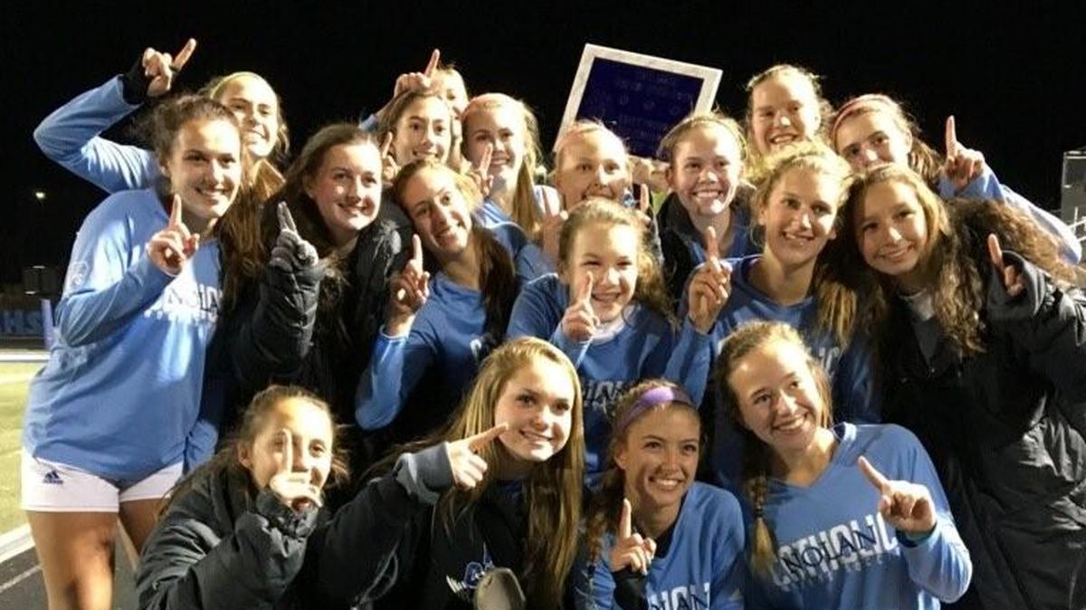 From 2017, Nolan Catholic players celebrate winning the Brewer Bear Cave Classic.
