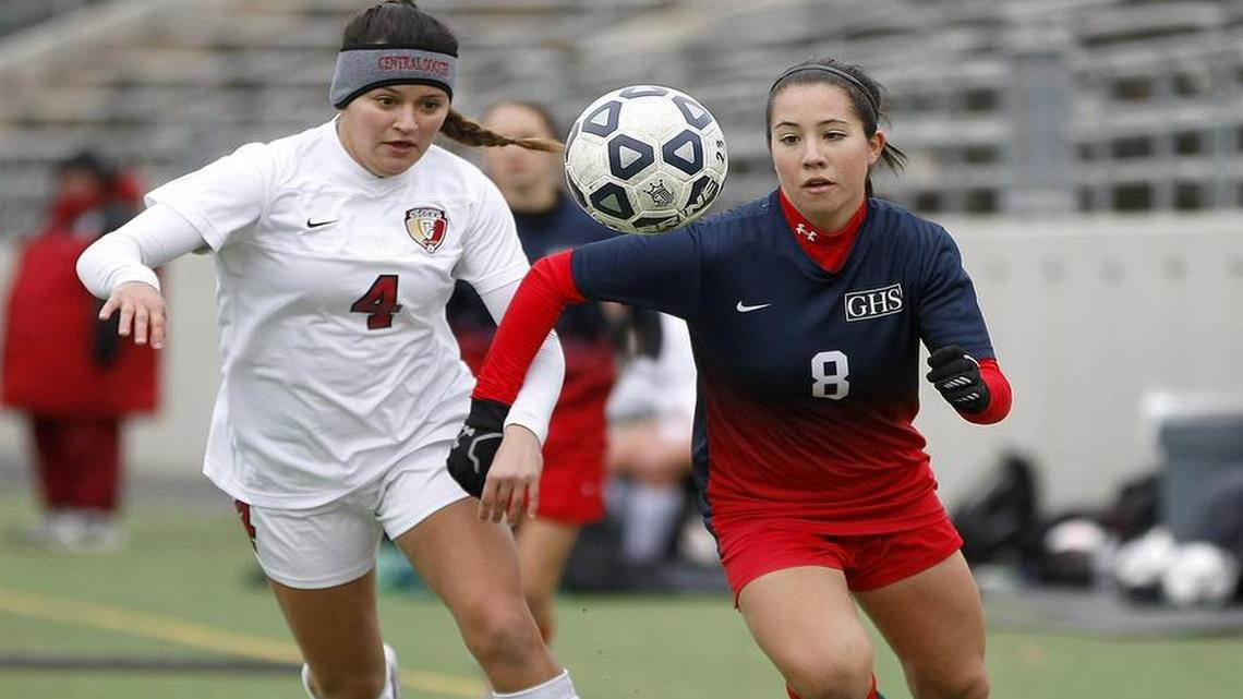 Grapevine’s Nikki Romero, right, races for the ball against Keller Central’s Stefanie Carballo