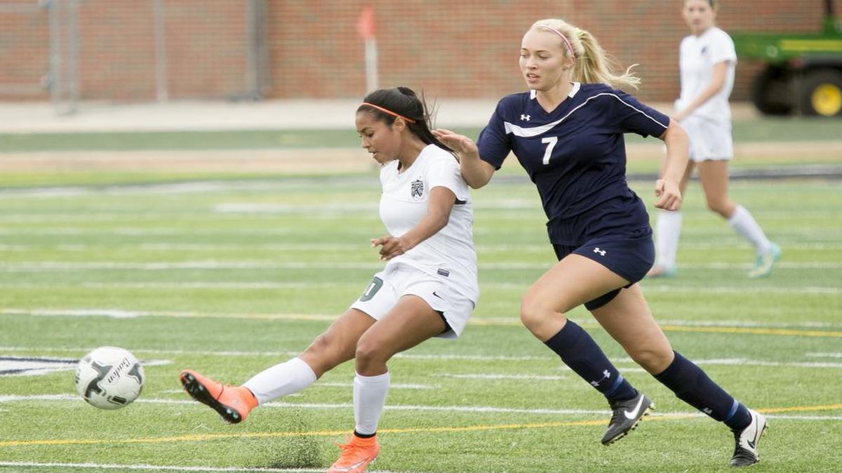 Kennedale's Alondra Olmos, left, passes up the field during Kennedale's 4A-Region 1 semifinal victory over Stephenville on April 8, 2016.