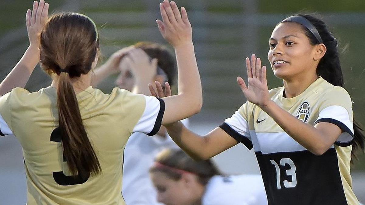Mansfield Tigers player Peyton Jameson (3) celebrates with Julie Shahi (13) after Shahi’s second half goal.