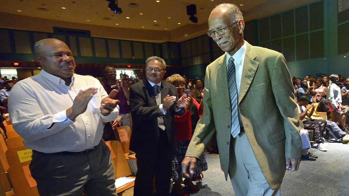 
Dunbar basketball coach Robert Hughes Jr., introduces his dad, retired Dunbar boys basketball coach Robert Hughes Sr., during the assembly to celebrate Robert Hughes, Sr. Day at Dunbar High School in Fort Worth, TX, Friday, May 29, 2015. 
