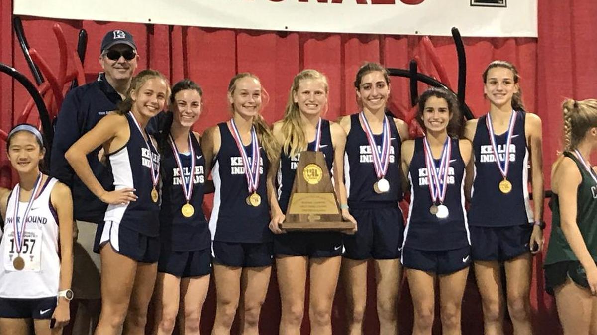 Keller girls cross country team poses with the first place trophy after winning the 6A Region I meet in Lubbock, October 23, 2017.