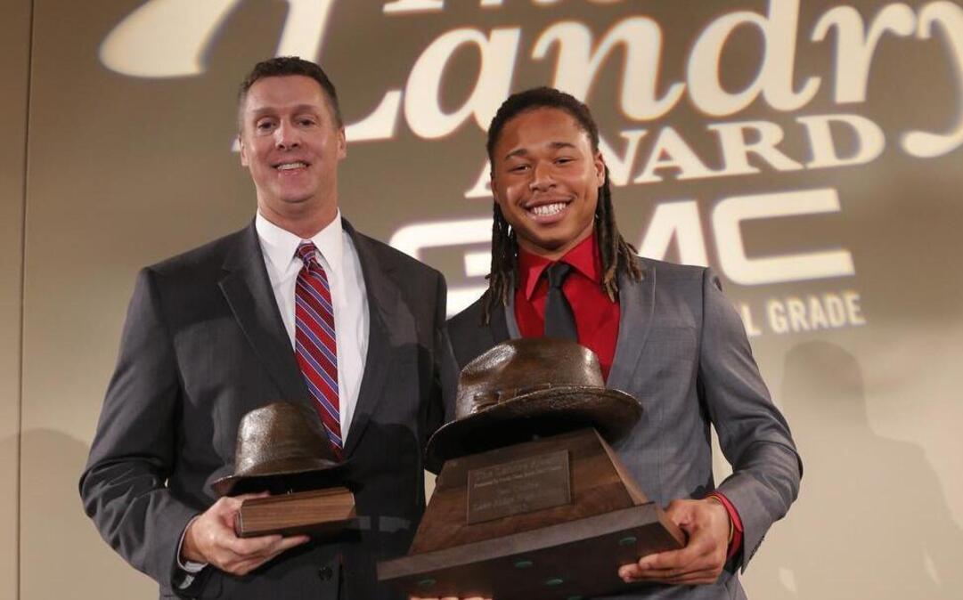 Grapevine coach Randy Jackson, left, and Mansfield Lake Ridge quarterback Jett Duffey were this year’s Tom Landry Award winners.