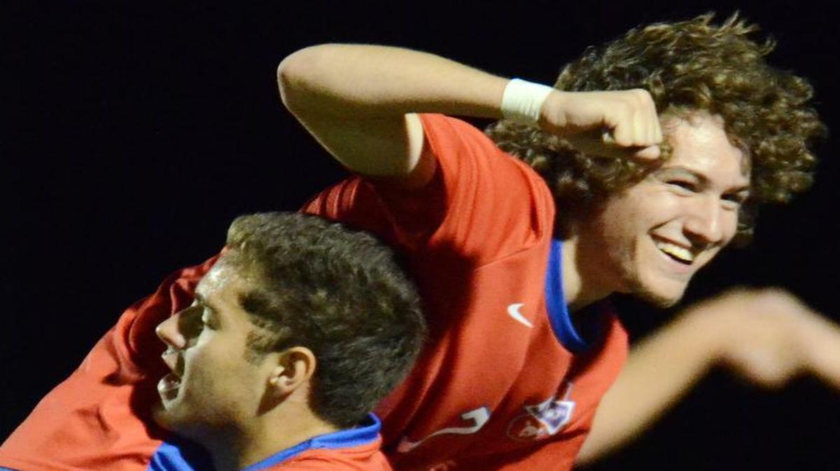 Grapevine’s John Morin lifts up teammate Austin Ginn in celebration after their 1-0 win over Wichita Falls on Tuesday.