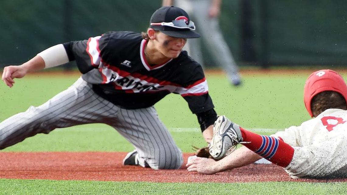 Colleyville Heritage’s Bobby Witt, left, tags out Grapevine’s Andrew Gootos during a high school playoff game in Texas.