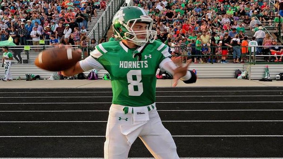 Azle quarterback Ken Seals (8) on the sidelines warming up before his first start against Grapevine, Friday, August 26, 2016.