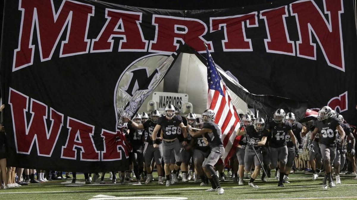 The Arlington Martin Warriors take the field earlier this month.